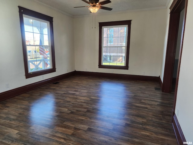 unfurnished room with ceiling fan, ornamental molding, and dark hardwood / wood-style flooring