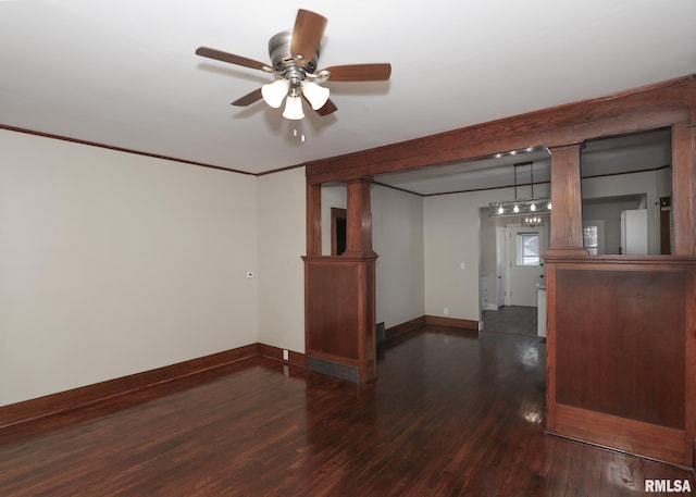 unfurnished room with dark hardwood / wood-style floors, ceiling fan, and crown molding