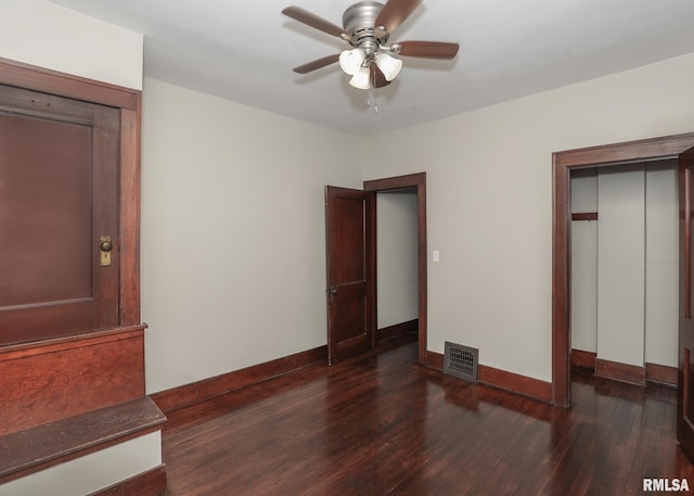 unfurnished bedroom featuring ceiling fan and dark hardwood / wood-style floors