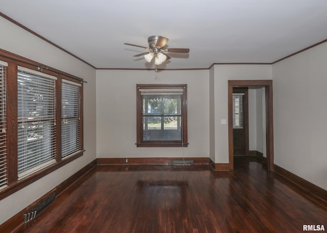 unfurnished room with ornamental molding, ceiling fan, and dark wood-type flooring