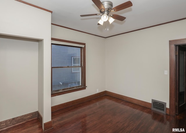 interior space featuring ceiling fan, dark hardwood / wood-style flooring, and crown molding