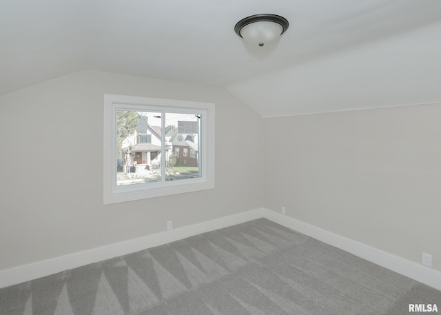 bonus room featuring carpet flooring and lofted ceiling