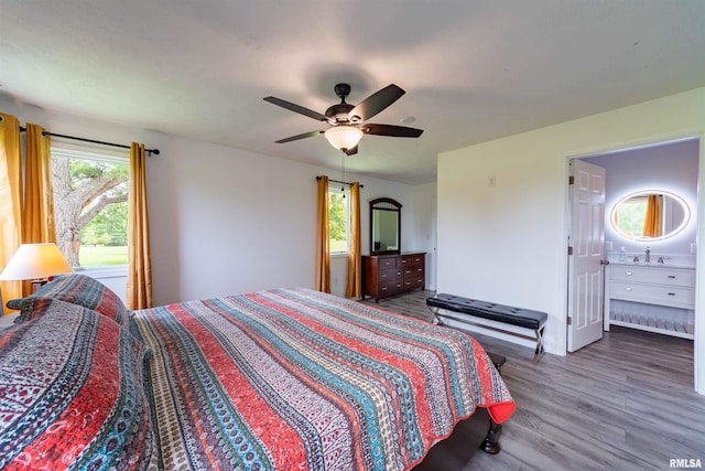 bedroom with ceiling fan, hardwood / wood-style floors, and multiple windows