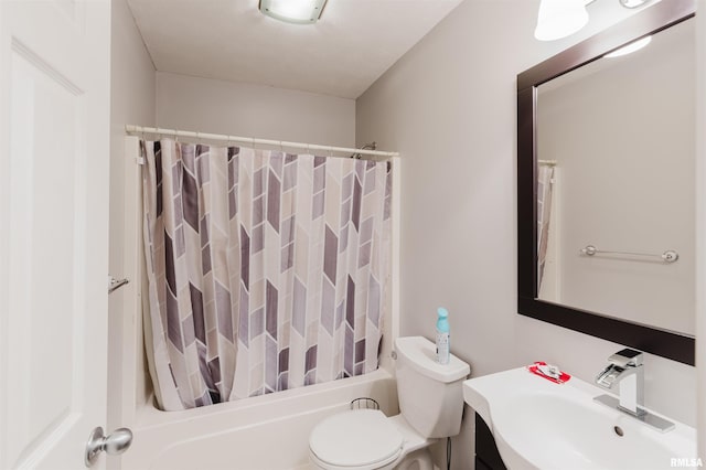 full bathroom featuring toilet, sink, and shower / bath combination with curtain