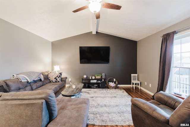 living room with lofted ceiling with beams, ceiling fan, and dark wood-type flooring