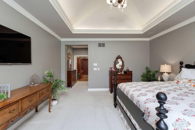 carpeted bedroom with ornamental molding and a raised ceiling