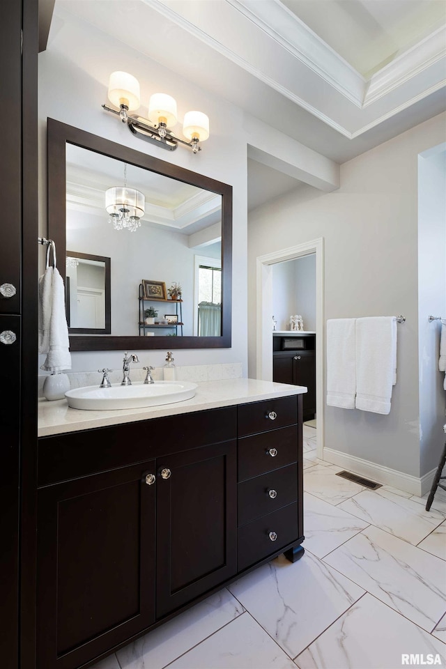 bathroom featuring vanity and ornamental molding