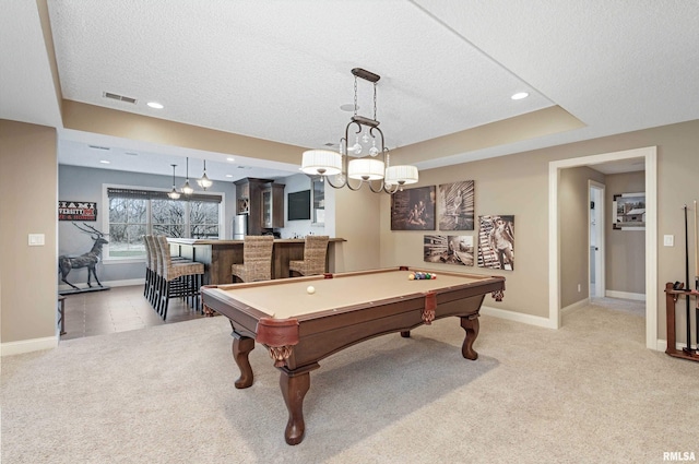 recreation room with bar area, a textured ceiling, billiards, and carpet