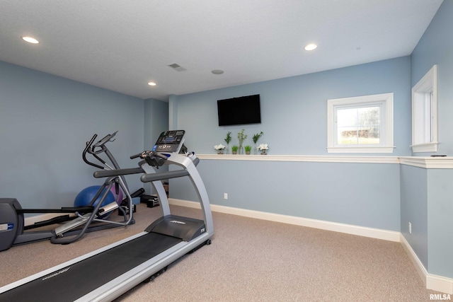 workout room featuring carpet flooring