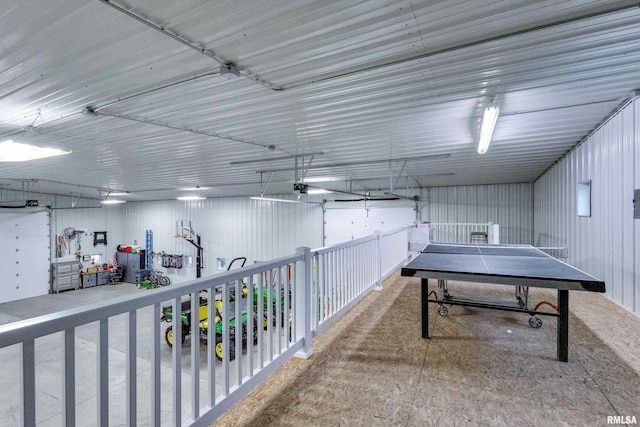 recreation room featuring concrete flooring