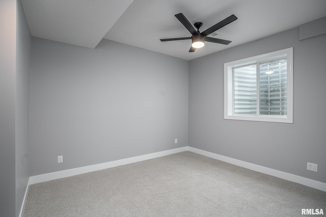 spare room with ceiling fan and carpet floors