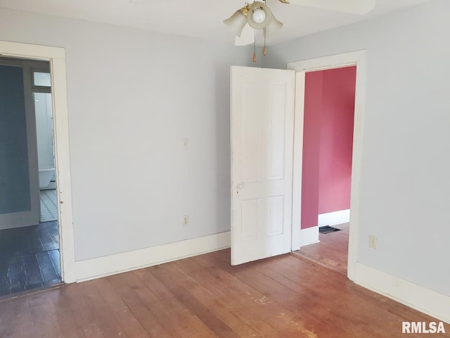 unfurnished room featuring hardwood / wood-style flooring and ceiling fan