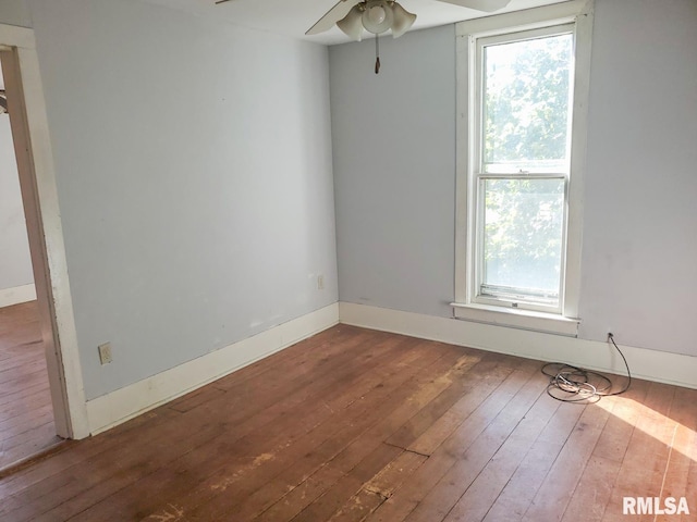 unfurnished room with ceiling fan and hardwood / wood-style flooring