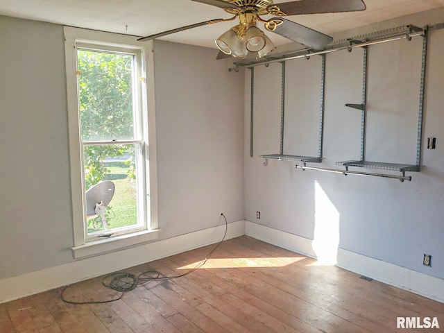 unfurnished room featuring ceiling fan and light hardwood / wood-style flooring