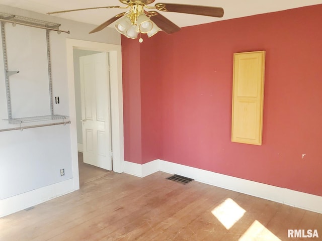 unfurnished room featuring ceiling fan and light hardwood / wood-style flooring