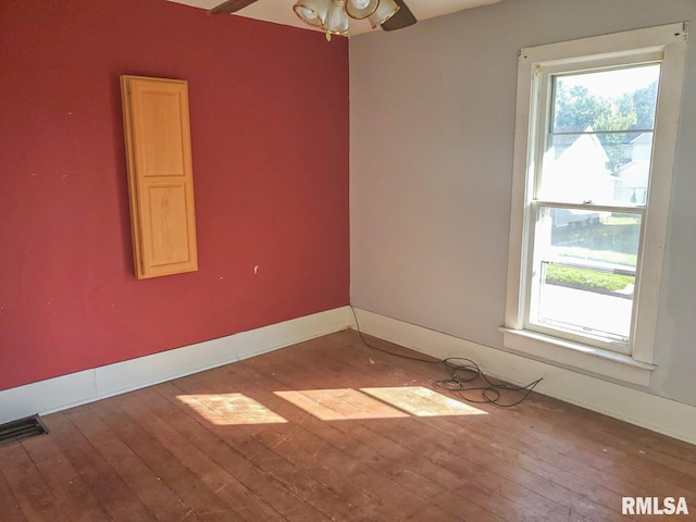 unfurnished room with hardwood / wood-style floors