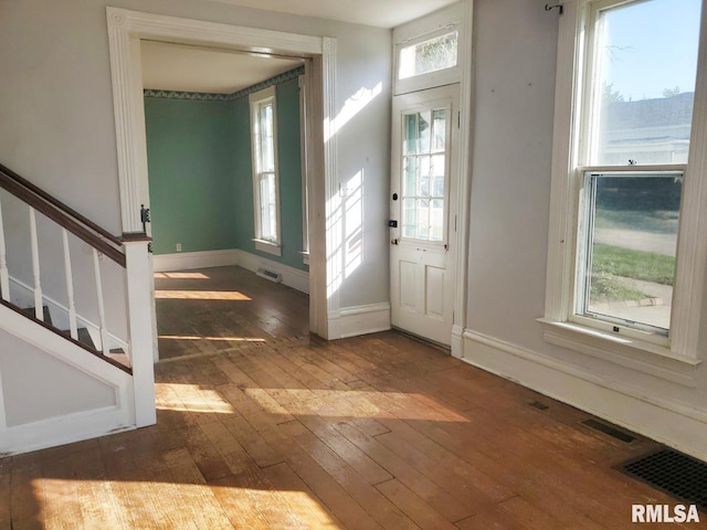 entryway with hardwood / wood-style flooring