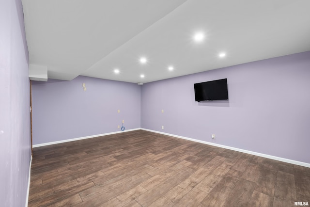 spare room featuring wood-type flooring