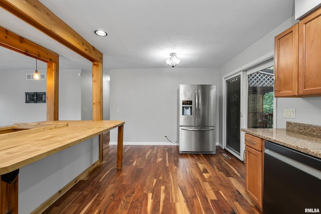 kitchen with pendant lighting, butcher block countertops, stainless steel fridge with ice dispenser, black dishwasher, and dark hardwood / wood-style flooring