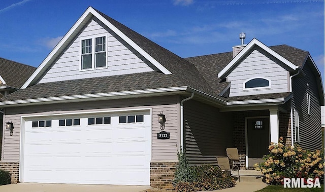 craftsman inspired home featuring a garage