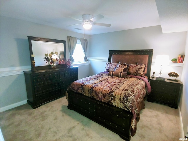 bedroom featuring light carpet and ceiling fan