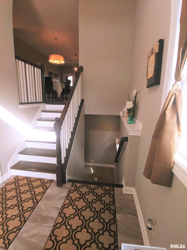 stairs with hardwood / wood-style flooring