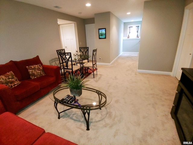 living room featuring light carpet