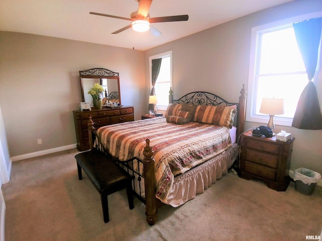 bedroom with light carpet and ceiling fan