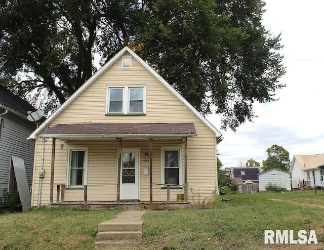 bungalow-style house featuring a porch and a front yard