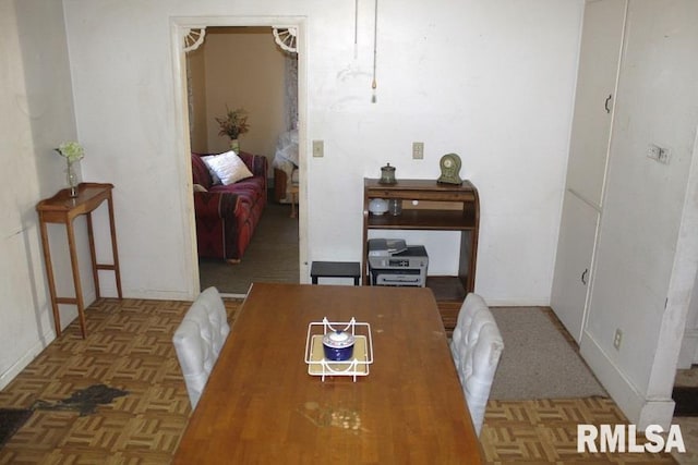 dining room with parquet flooring