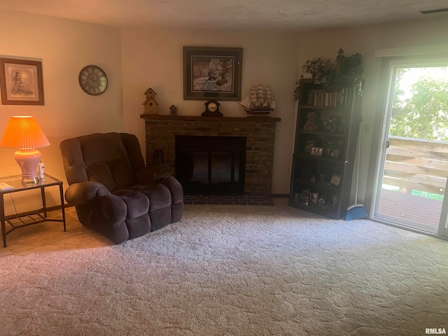 carpeted living room featuring a fireplace