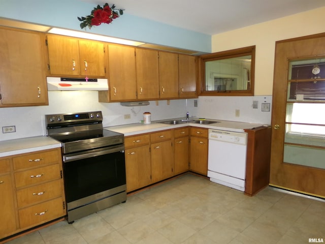 kitchen featuring white dishwasher, stainless steel electric stove, and sink