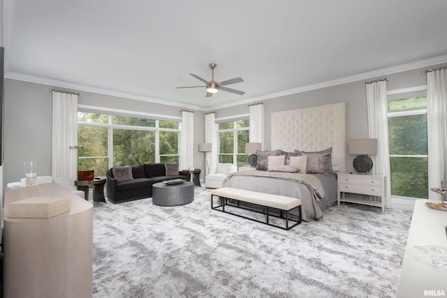 bedroom with ornamental molding, ceiling fan, and multiple windows