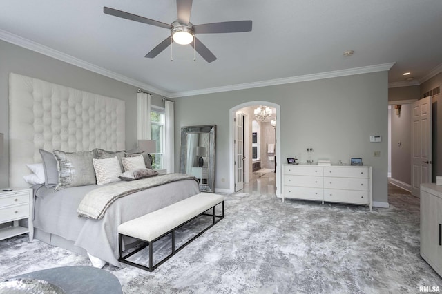 bedroom featuring ensuite bath, ceiling fan, and crown molding