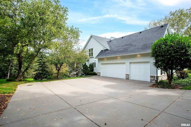 view of side of property featuring a garage