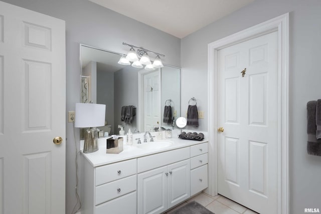 bathroom with tile patterned flooring and vanity