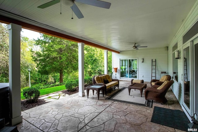 view of patio with an outdoor living space and ceiling fan