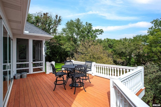 wooden terrace featuring a sunroom