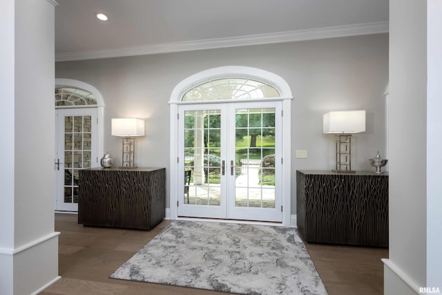 entryway featuring french doors, hardwood / wood-style flooring, and crown molding