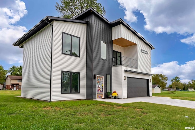 contemporary house with a balcony, a front yard, and a garage