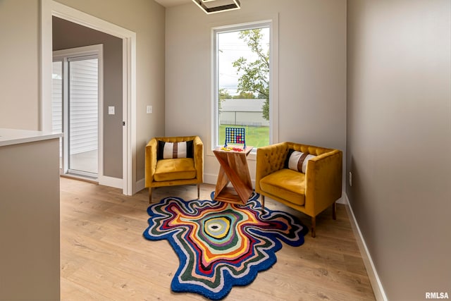 sitting room with light hardwood / wood-style flooring