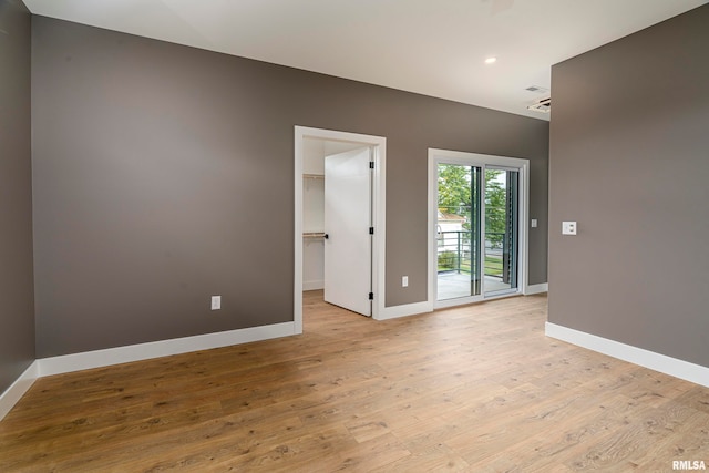 unfurnished room featuring light wood-type flooring