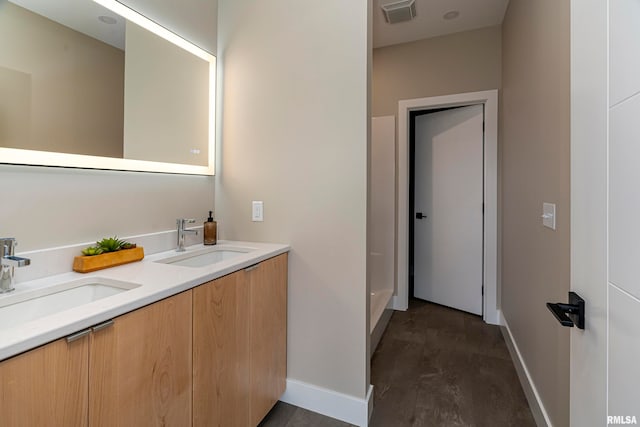 bathroom with vanity and hardwood / wood-style floors