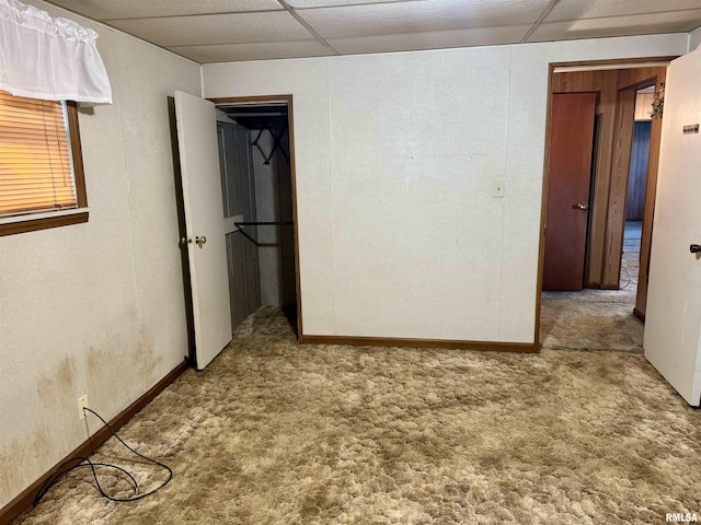 carpeted spare room with baseboards