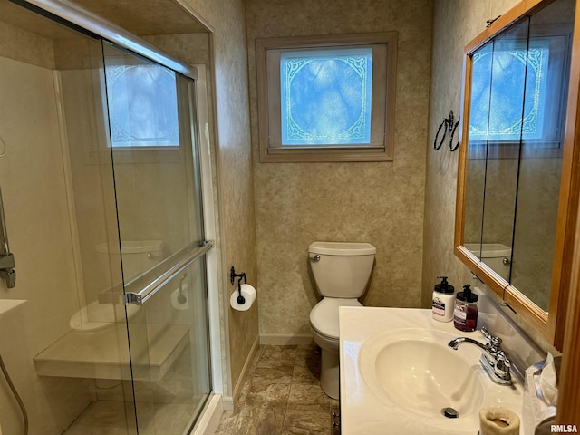 full bathroom with a shower stall and a wealth of natural light