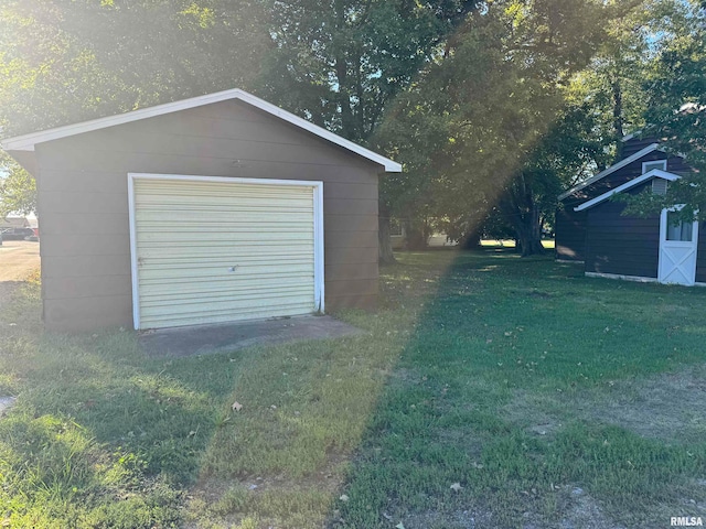 garage featuring a yard