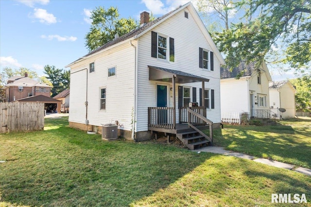 view of front facade with central AC unit and a front lawn