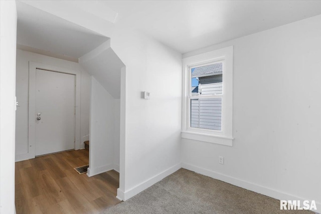 bonus room featuring hardwood / wood-style flooring