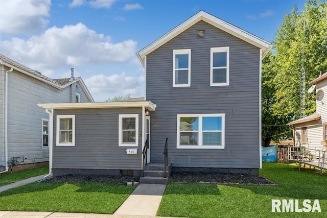 view of front of home featuring a front lawn