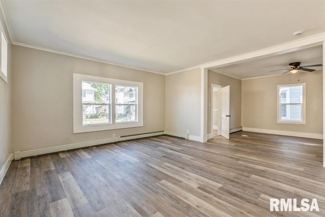 unfurnished room with crown molding, hardwood / wood-style floors, ceiling fan, and a baseboard radiator